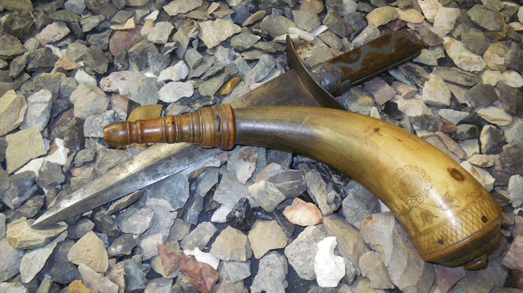 A 1750’s screw-top powder horn and a knife known as a “Virginia dirk” with a wood and pewter handle from the same period.