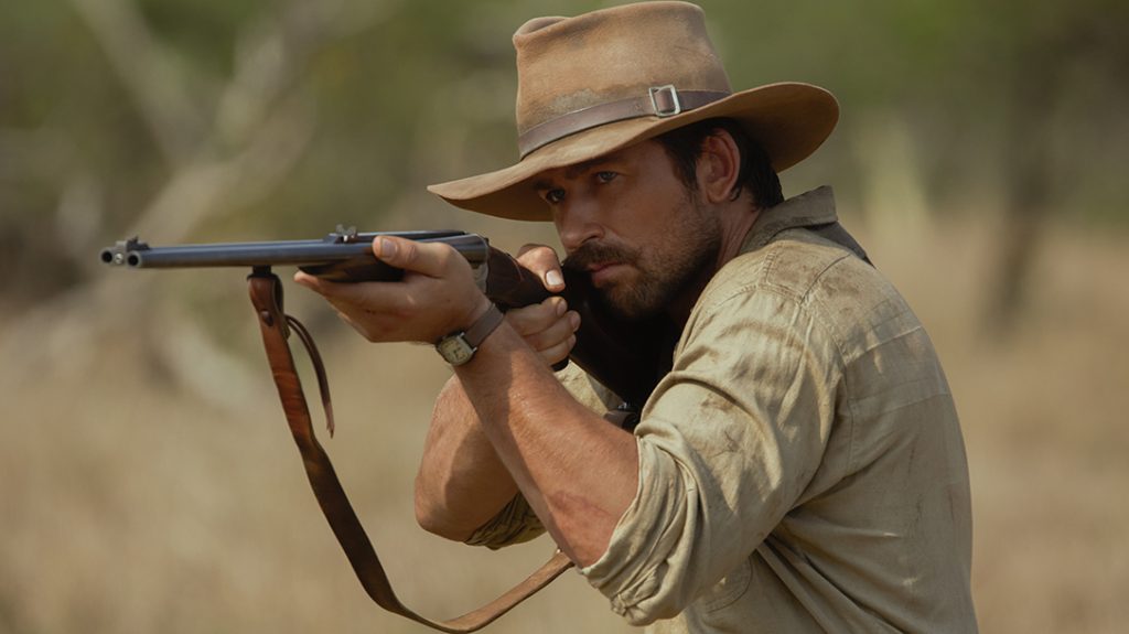 Brandon Sklenar as Spencer Dutton with the double barrel rifle – likely a Holland & Holland. 