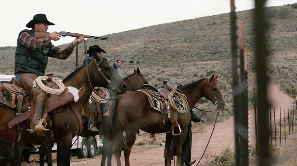 Lever action guns are still a choice of cowboys. The Yellowstone ranch hand in the foreground has a Marlin Model 336 while the other cowboy is armed with a Winchester Model 1894.