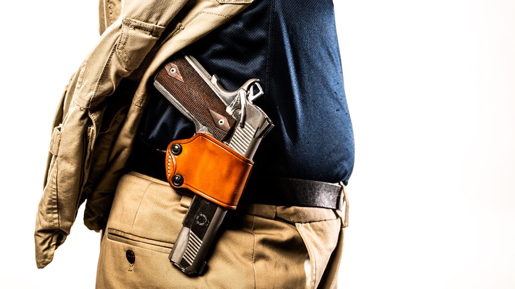 A 1911 being carried in a traditional holster