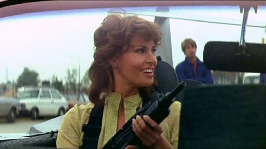 Raquel Welch was arguably the first big screen "starlet" to be seen with an Uzi in the film Stuntwoman