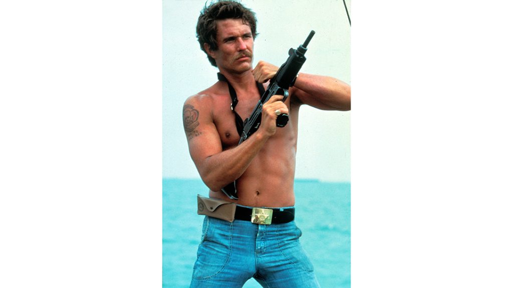 Tom Berenger with an Uzi in Dogs of War.